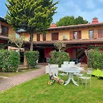 Garden-front House In Апартаменты Бибионе